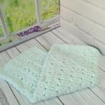 Patterned baby blanket made with knitted and plush (puffy) yarn