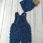 Hand-knitted baby romper and hat set. Embossed and bud-patterned.