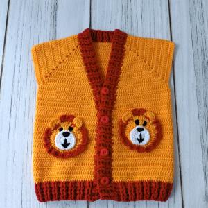Hand-knitted, lion-themed, yellow and red baby cardigan